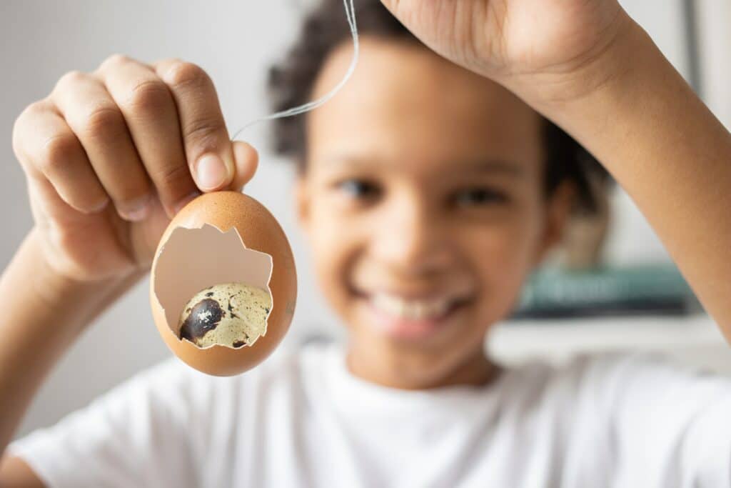 boy holding egg